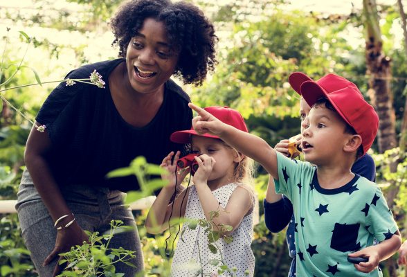 Children looking at flower